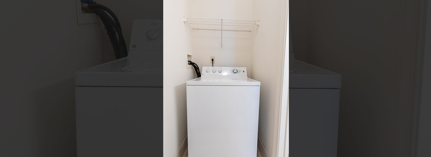Full size washer and dryer in laundry area