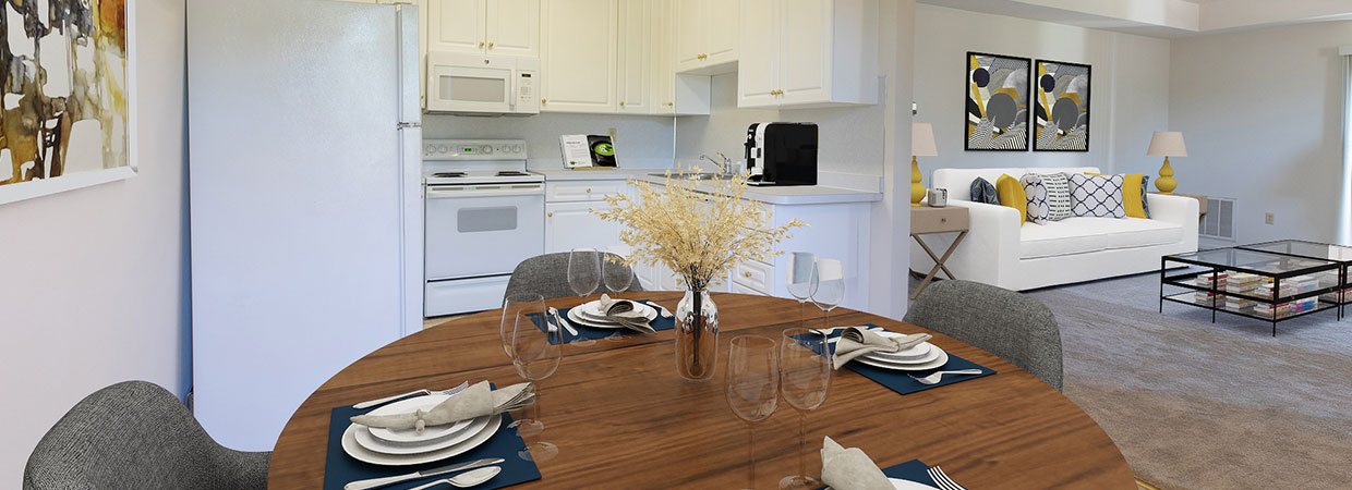 Standard white kitchen with dining area to living room